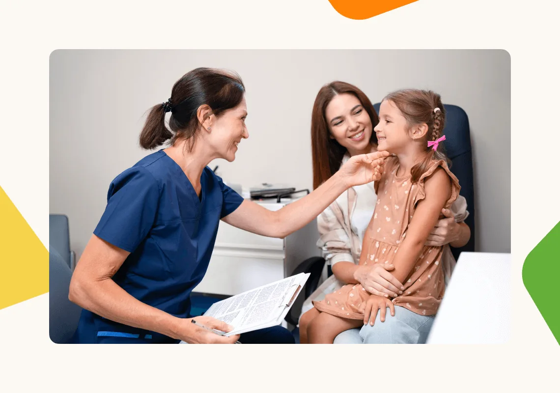 Optometrist speaking with a patient and their family