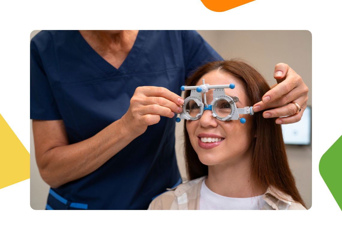Optometrist fitting trial frames on a smiling patient