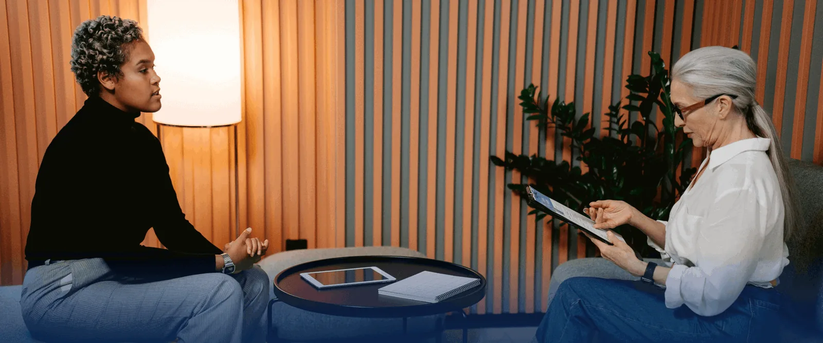 HR manager talking with a colleague in a bright meeting room